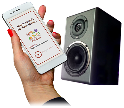 hand holding smart phone with audio player and loudspeaker behind